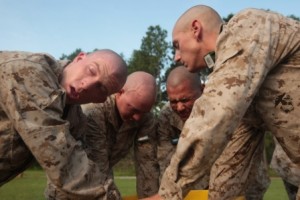 Recruits of Kilo Company, 3rd Recruit Training Battalion, rush out of a gas chamber during chemical defense training.