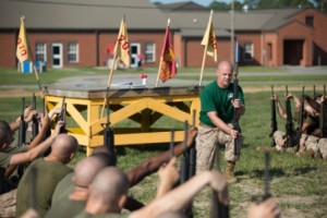 Sgt Jospeh Miller, a Martial Arts Instructor, demonstrates a block to recruits of Hotel Company, 2nd Recruit Training. (Photo by Lance Cpl. Vaniah Temple)