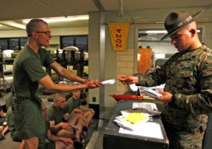 Rct. Joshua West, a 19-year-old from Carrollton, Ga., receives mail from his senior drill instructor Feb. 8 during mail call. Picture taken by Lance Cpl. Francisco Abundes.