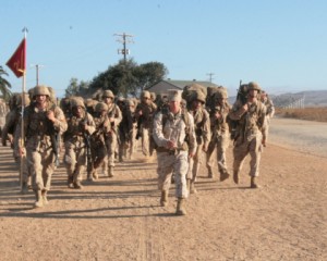 Recruits get motivated and pick up the pace as they make the last stretch of the Crucible's 10-mile hike at Camp Pendleton, CA.  (Photo by Sgt. Jamie Paetz)