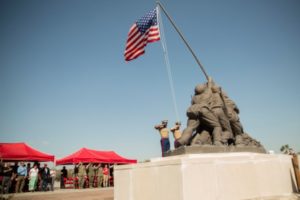 The Recruit Training Regiment color guard raises the American flag during the unveiling ceremony of the iconic Iwo Jima statue March 14, 2016. (Photo by Sgt. Jennifer Schubert)