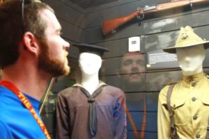 James Simpson, an English teacher at Dolgeville High school, views Marine Corps uniforms of the past at the Parris Island Museum during the Educators’ Workshop. (Photo by Cpl. Brandon Thomas)