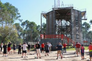 Educators prepare to descend on the repel tower during the Educators’ Workshop, at Recruit Training Depot Parris Island, The repel tower is one of many challenges recruits must overcome before earning the title of Marine. (Photo by Cpl. Brandon Thomas)