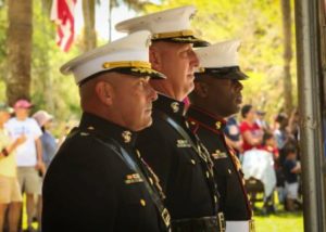 The Tri-command leadership stands for the Marine Corps Hymn during the Memorial Day Ceremony at the Beaufort National Cemetery, May 29. (Photo by Lance Cpl. Benjamin McDonald)