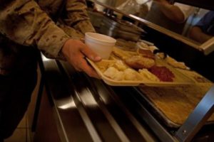 A recruit grabs a dessert on Parris Island, S.C. Each hot meal consists of at least an entree, starch, vegetable, soup and dessert.(Photo by Lance Cpl. David Bessey)