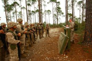 A drill instructor briefs his squad of recruits on a Crucible event, during the Crucible. (Photo by Lance Cpl. Javarre Glanton)