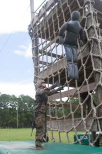 A recruit prepares to catch a simulated casualty during the Crucible at the combat training area on Parris Island, S.C. (Photo by Lance Cpl. MaryAnn Hill)