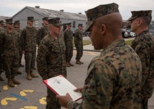 U.S. Marine Corps Sgt. Maj. Cortez L. Brown, sergeant major of 6th Marine Corps District, reads the promotion warrant for Chief Warrant Officer Matthew Kessinger, personnel officer of 6th MCD, during Kessinger's promotion to chief warrant officer five aboard MCRD Parris Island. (photo by Lance Cpl. Jack A. E. Rigsby)