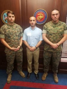 Michael Campofiori poses for a photo with Sgt. William Todd, a recruiter with Recruiting Substation Myrtle Beach, and Gunnery Sgt. Christopher Falk, the Staff noncommissioned officer-in-charge of Recruiting Substation Myrtle Beach, after swearing in to the Marine Corps on Aug. 16, 2018