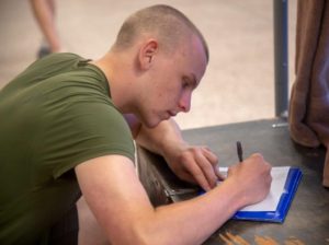 Recruit Isaac Brunson, from Richmond Va., writes a letter home while assigned to Recruit Separation Platoon, Special Training Company, Marine Corps Recruit Depot Parris Island. (U.S. Marine Corps photo by Cpl Daniel O'Sullivan)