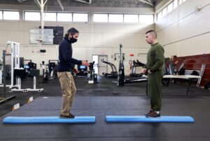 It is the athletic trainers’ job to ensure that the recruits and drill instructors are taking the proper steps to increase injury prevention awareness and help them recover if injuries occur. (U.S. Marine Corps photo by Lance Cpl. Samuel C. Fletcher)