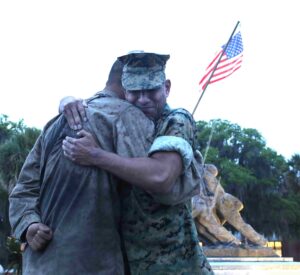 Pvt. Joshua Kaza was awarded his Eagle, Globe and Anchor by his dad Lt. Col. Babu Kaza. (U.S. Marine Corps photo by CWO3 Bobby Yarbrough)