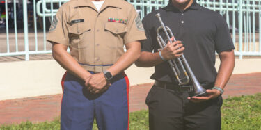 U.S. Marine Corps Staff Sgt. Carlos Ortiz, the music technical assistant for 6th Marine Corps District, and Evan Nazario, a Music Enlistment Option Program candidate. (U.S. Marine Corps photo by Lance Cpl. Kevin Lopez Herrera)