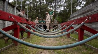 U.S. Marine Officer Candidates, with 6th Marine Corps District, discuss their plan for an obstacle in the Leadership Reaction Course. (U.S. Marine Corps photo by Staff Sgt. Shannon Doherty)